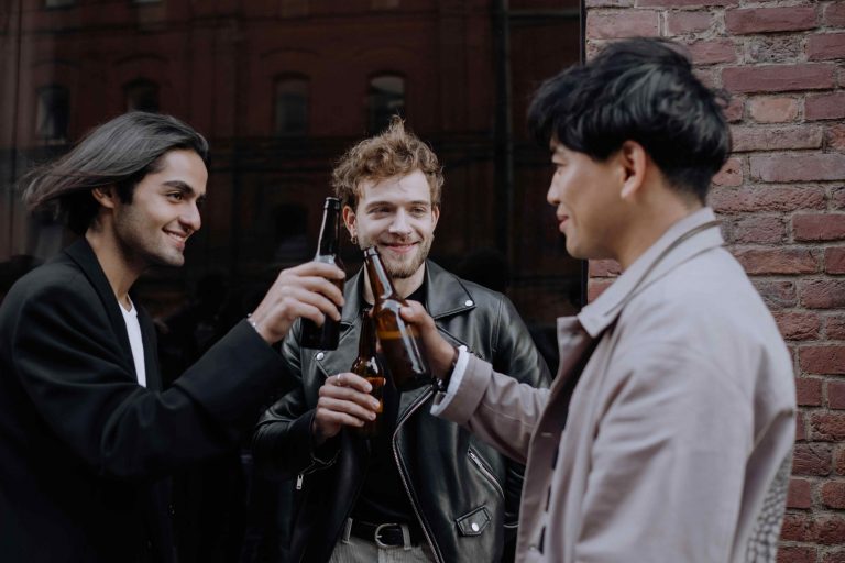 male drinking and saluting each other